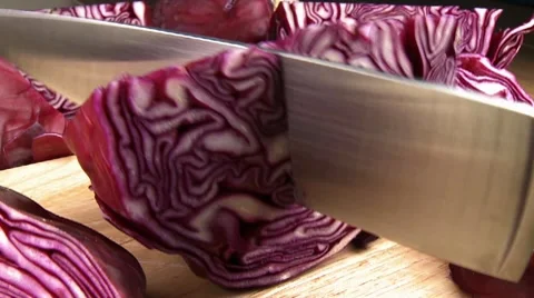 Cutting up red cabbage with a knife Stock Footage 8571749