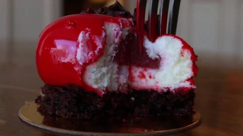 Cutting into red heart-shaped cake with fork Stock Footage 153094662