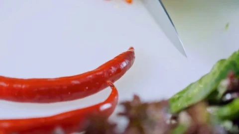 Cutting red hot pepper Видео 84280639