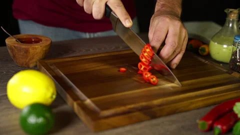 Cutting Red Jalapeno on the board Stock Footage 243501918