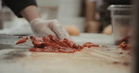 Cutting up a red pepper fire girlled Stock Footage 105310909