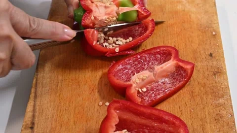 Cutting red pepper, on a table Stock Footage 219720387
