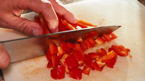 Cutting red peppers light slow motion on cutting board Stock Footage 258620424