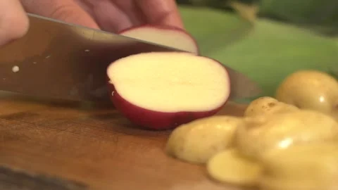 Cutting a red potato Stock Footage 137652030