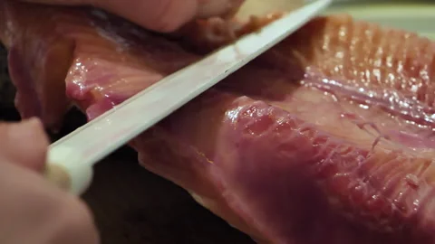 Cutting of red salmon fish. The process of salting sea trout Stock Footage 273854579