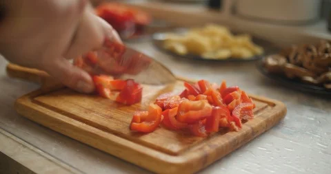 Cutting red sweet pepper on the cutting board Stock Footage 87861478