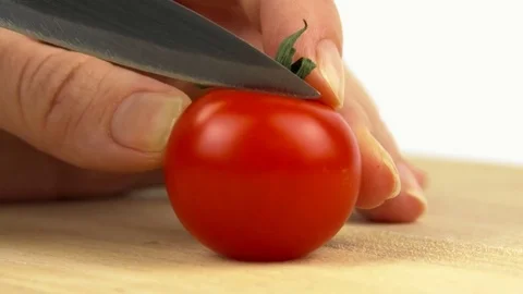 Cutting red tomatoes Stock Footage 83054870