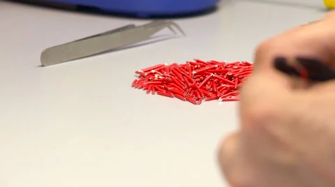 Cutting Red Wire Into Small Peaces With Nipper .close up of Working Process. Stock Footage 67460614