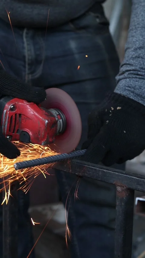 Cutting reinforcement with a grinder, close-up Stock Footage 328358729