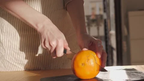 Cutting ripe oranges on board close-up. Orange citrus fruits, making fresh juice Stock Footage 172556677