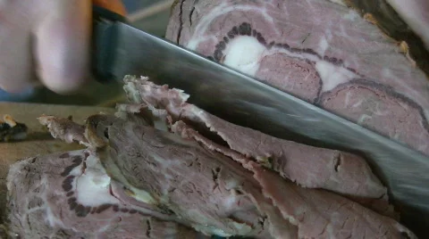 Cutting roast beef. Closeup. Stock Footage
