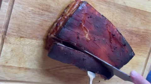 Cutting a roast pork belly Stock Footage 219283652