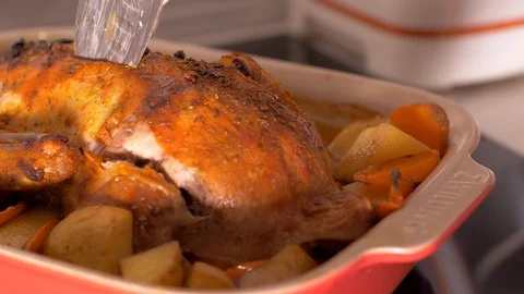 Cutting a roasted duck Stock Footage 103631872