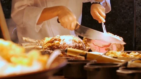 Cutting roasted lamb,slicing Stock Footage 77265328