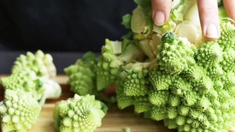 Cutting Romanesco broccoli Stock Footage
