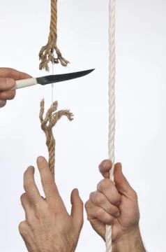 Cutting a rope Stock Photos