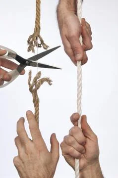 Cutting a rope Stock Photos