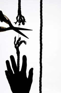 Cutting a rope Stock Photos