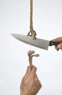 Cutting a rope Stock Photos