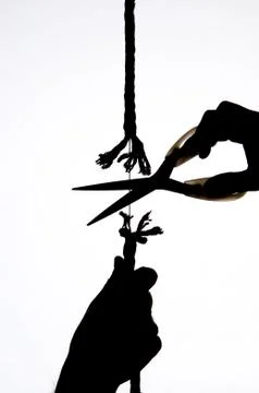 Cutting a rope Stock Photos