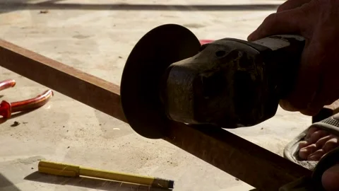 Cutting rustic steel bar with electric cutter. Stock Footage 162161789