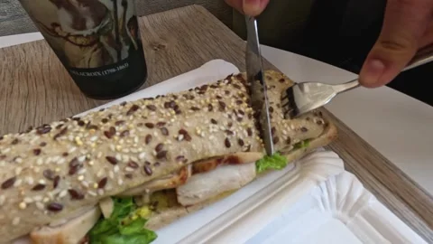 Cutting a Sandwich in Paris Stock Footage 299130075