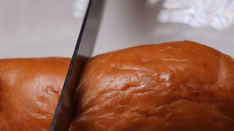 Cutting a sausage with a knife in macro Stock Footage 104596371