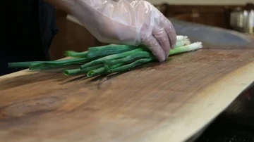 CUTTING SCALLIONS 2 Stock Footage 85664937