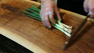CUTTING SCALLIONS Stock Footage 85664713
