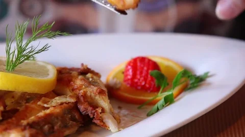 Cutting schnitzel on plate Stock Footage 75194241