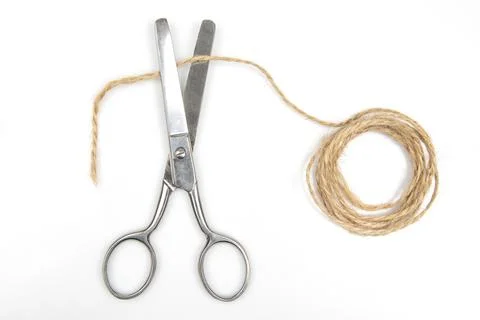 Cutting scissors and thread rope isolated on white background Stock Photos