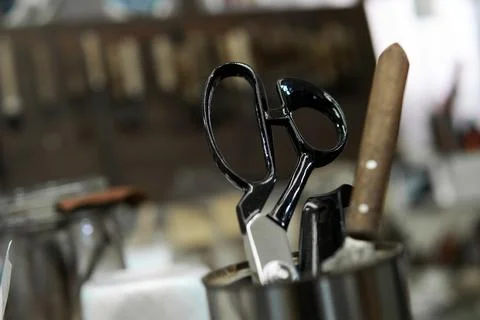 Cutting scissors in a can at the shoemaking workshop Stock Photos