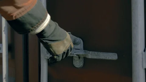 Cutting seal from a freight container. Work in the port. Port workers 스톡 동영상 106086025