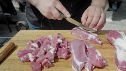 Cutting selected meat to pieces with knife for favorite dish Video stock 247761885