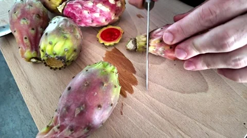 Cutting several fresh prickly pear fruits in kitchen Stock Footage 345081240