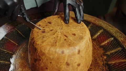 Cutting Shah Pilaf with Bread Crust Stock Footage 302088746