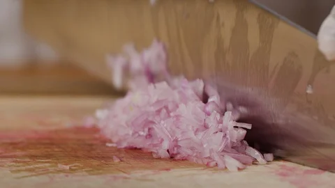 Cutting shallot onion macro shot, preparing ingredients for Tar Tar Stock Footage 128489228