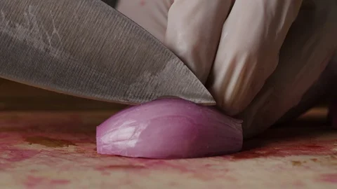 Cutting shallot onion macro shot, preparing ingredients for Tar Tar Stock-Footage 128489259