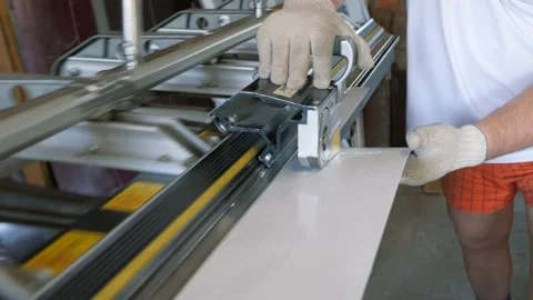 Cutting a sheet of metal. Construction of a private house. Stock Footage 230278723