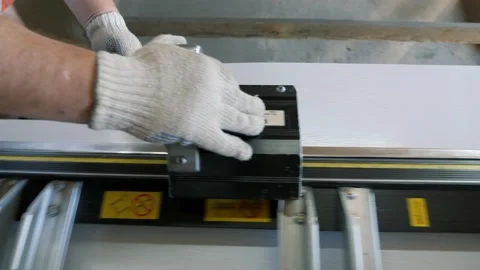 Cutting a sheet of metal. Construction of a private house. Stock Footage 231805787