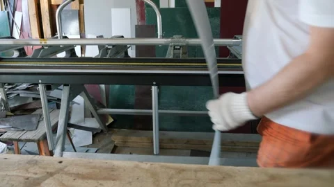 Cutting a sheet of metal. Construction of a private house. Stock Footage 252088786