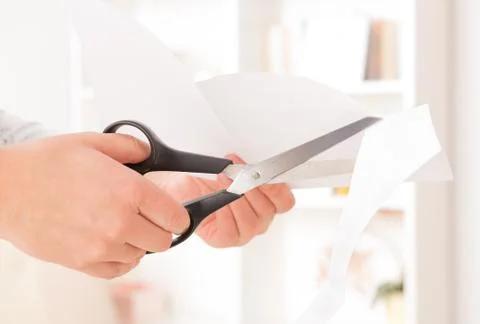 Cutting sheet of paper Stock Photos