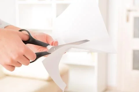 Cutting sheet of paper Stock Photos