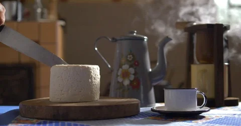 Cutting a slice of cheese at the farmhouse Video stock 82340885