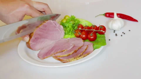 Cutting the slice of ham on board Stock Footage 59758584