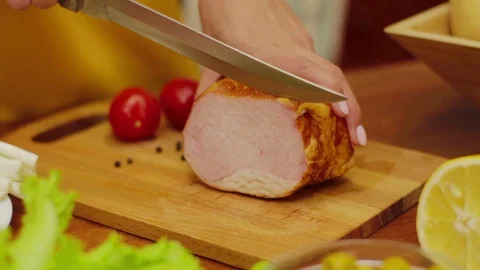Cutting slice of ham on wooden board Stock Footage 94168043