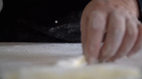 Cutting slice method of pasta gnocchi front view Stock Footage 128988054