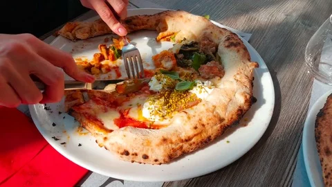 Cutting slice of original Pizza in Naples, Italy Stock Footage 81338044