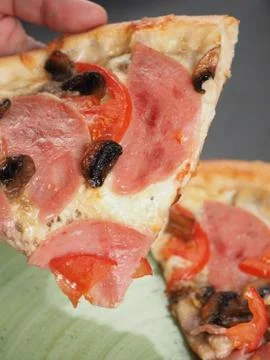 Cutting slice of pizza close up Stock Photos