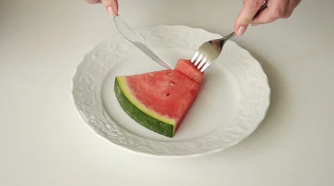 Cutting off a slice of red watermelon Video stock 38521055